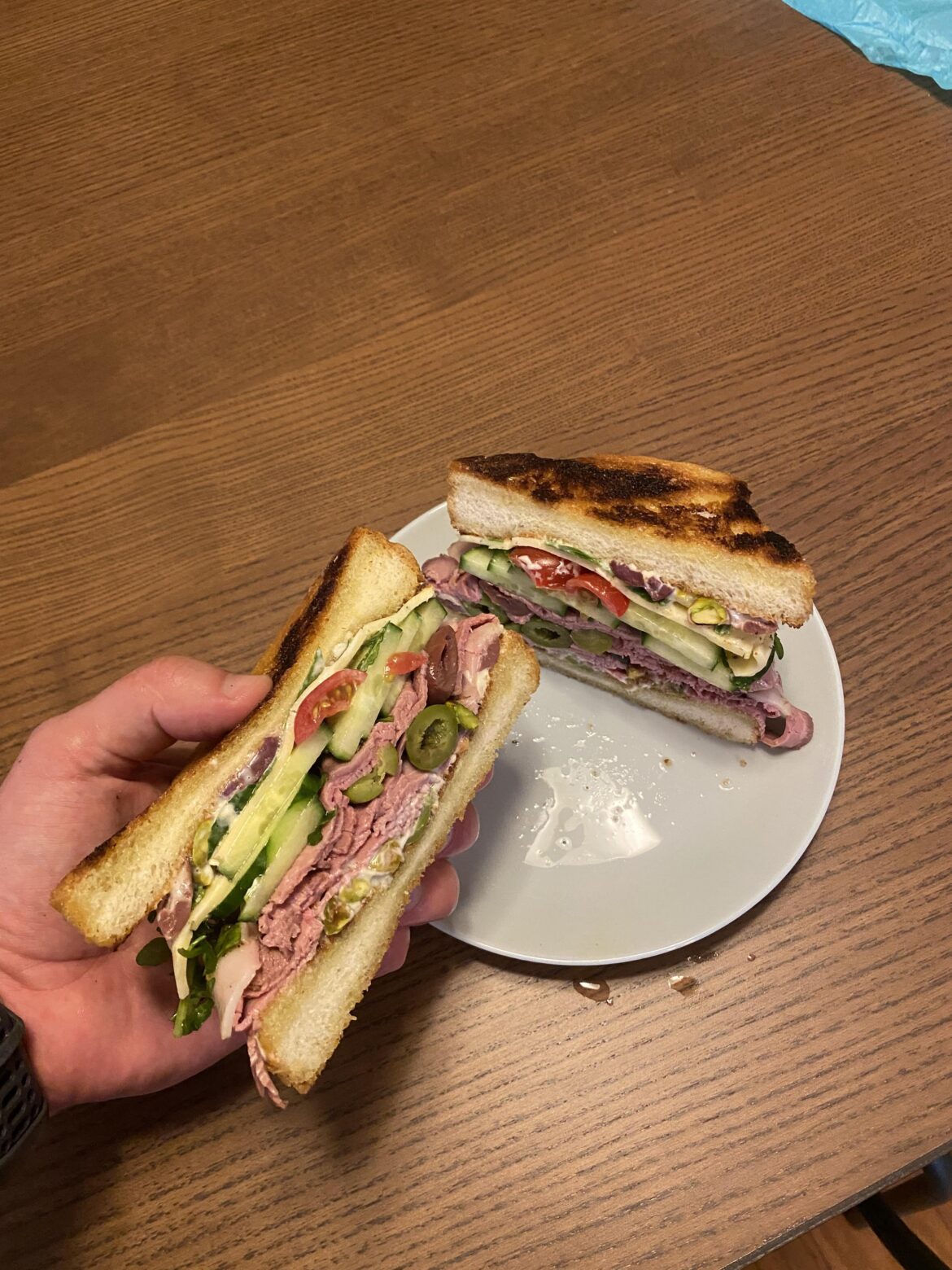 Roast lamb, olives, pistachios, arugula, tomato, cucumber, lemon mayo on Texas toast