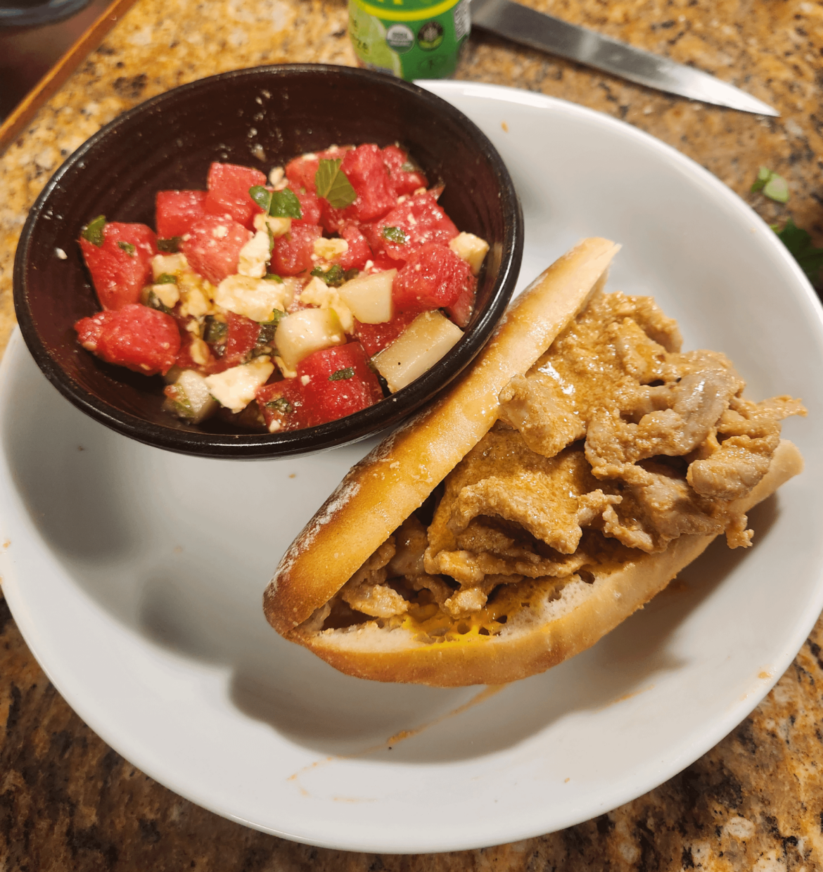 Lisbon style Bifana with cucumber watermelon salad.