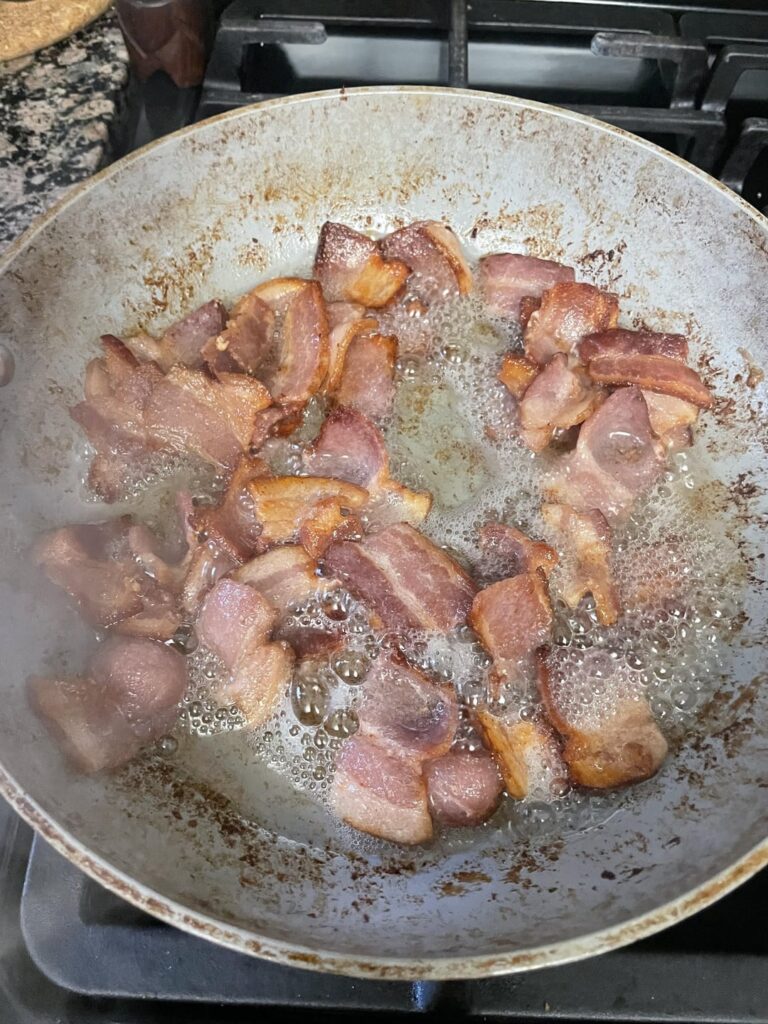 Cutting bacon strips into pieces with scissors before frying is cleaner, quicker, just as delicious, and better size for snacking