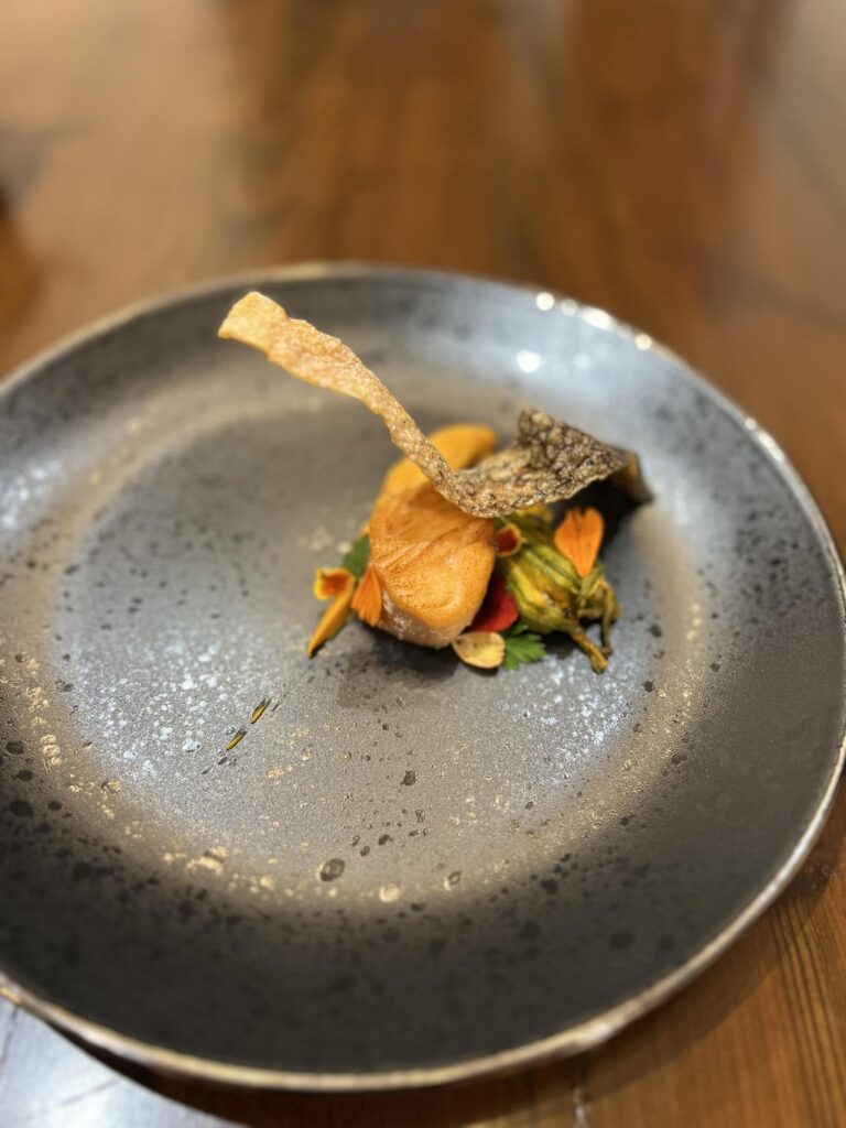 Salmon, stuffed squash blossom, prawn sauce