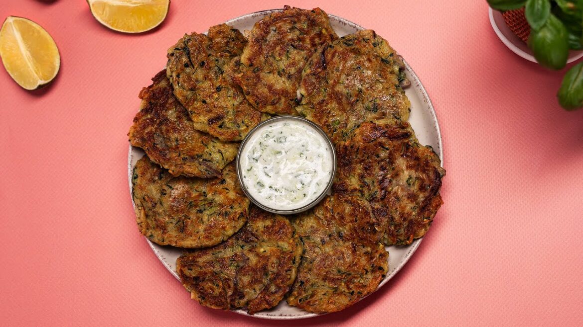 Zucchini season! A simple recipe for zucchini fritters in a frying pan with tzatziki sauce!