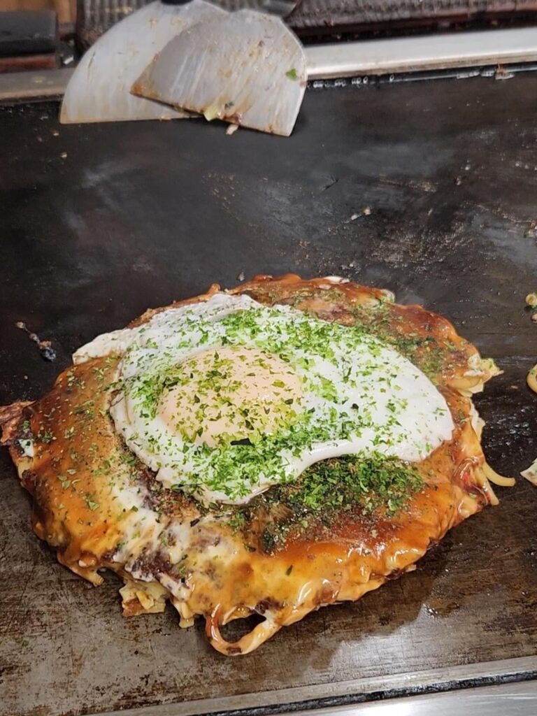 Okonomiyaki served on the flat top!