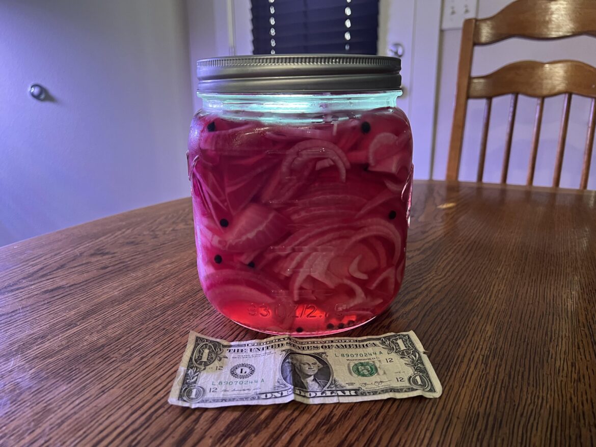 4 large pickled reds. Ready to eat. Dollar for scale.  PRAISE BE THE ONION.