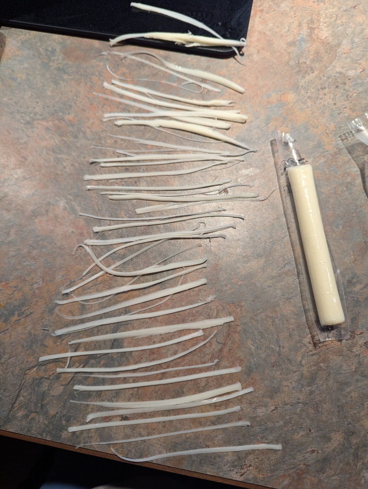 I managed to get 43 full length strings from one piece of string cheese. Did anyone else do this as a kid?