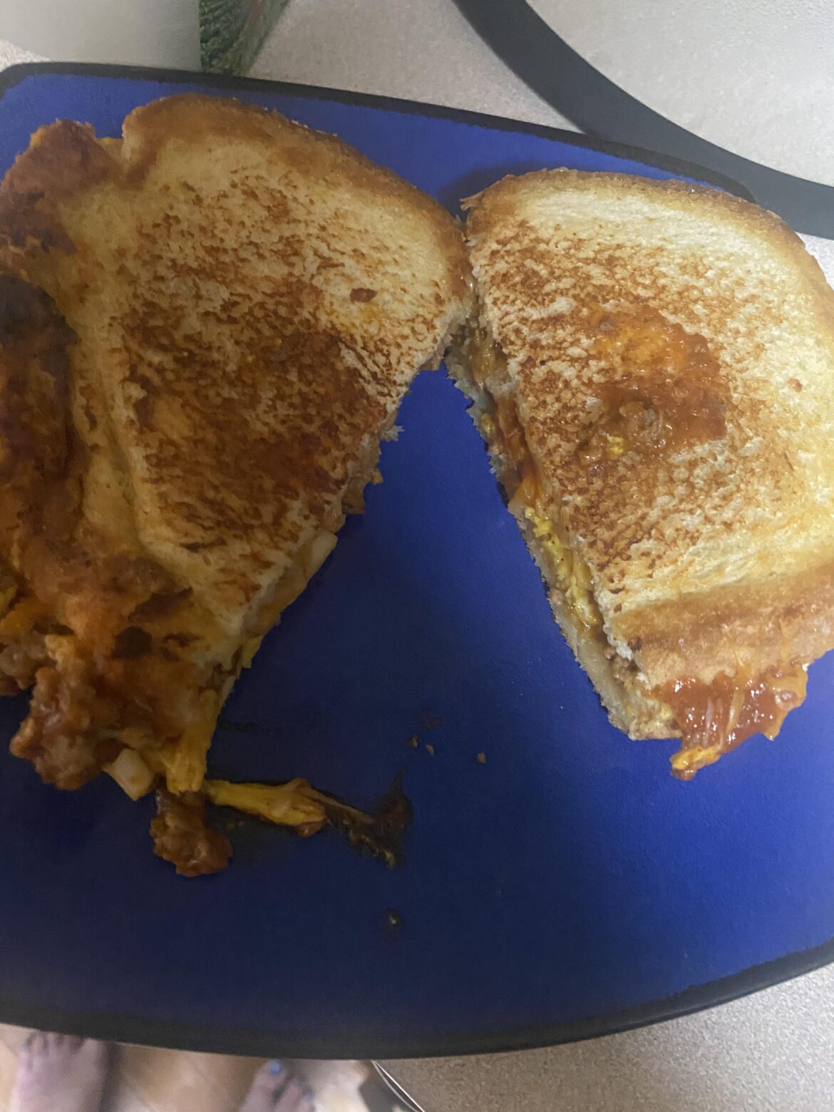 Sloppy joe grilled cheese with, onions, and mustard and a ton of Colby jack!