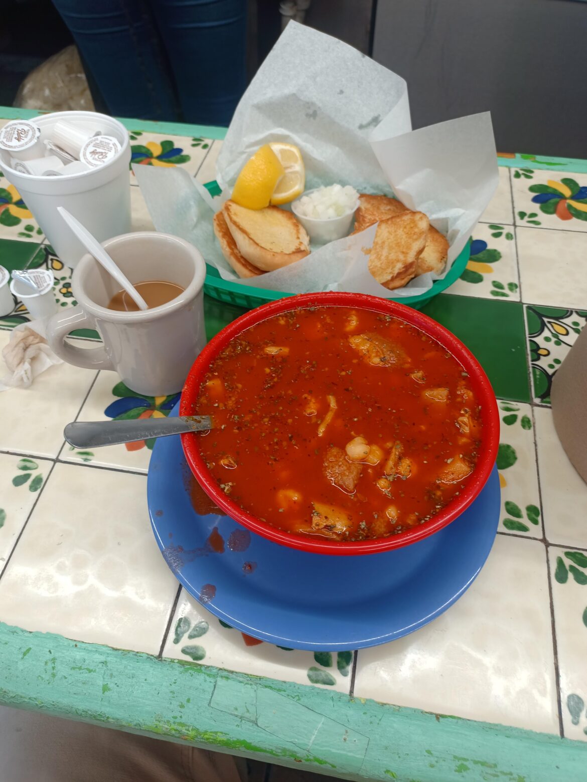 I just wanted to treat myself with a nice menudo breakfast after waking for a 7:30am service call. All the Doñas took up the booths and tables after misa so I'm here at the counter.