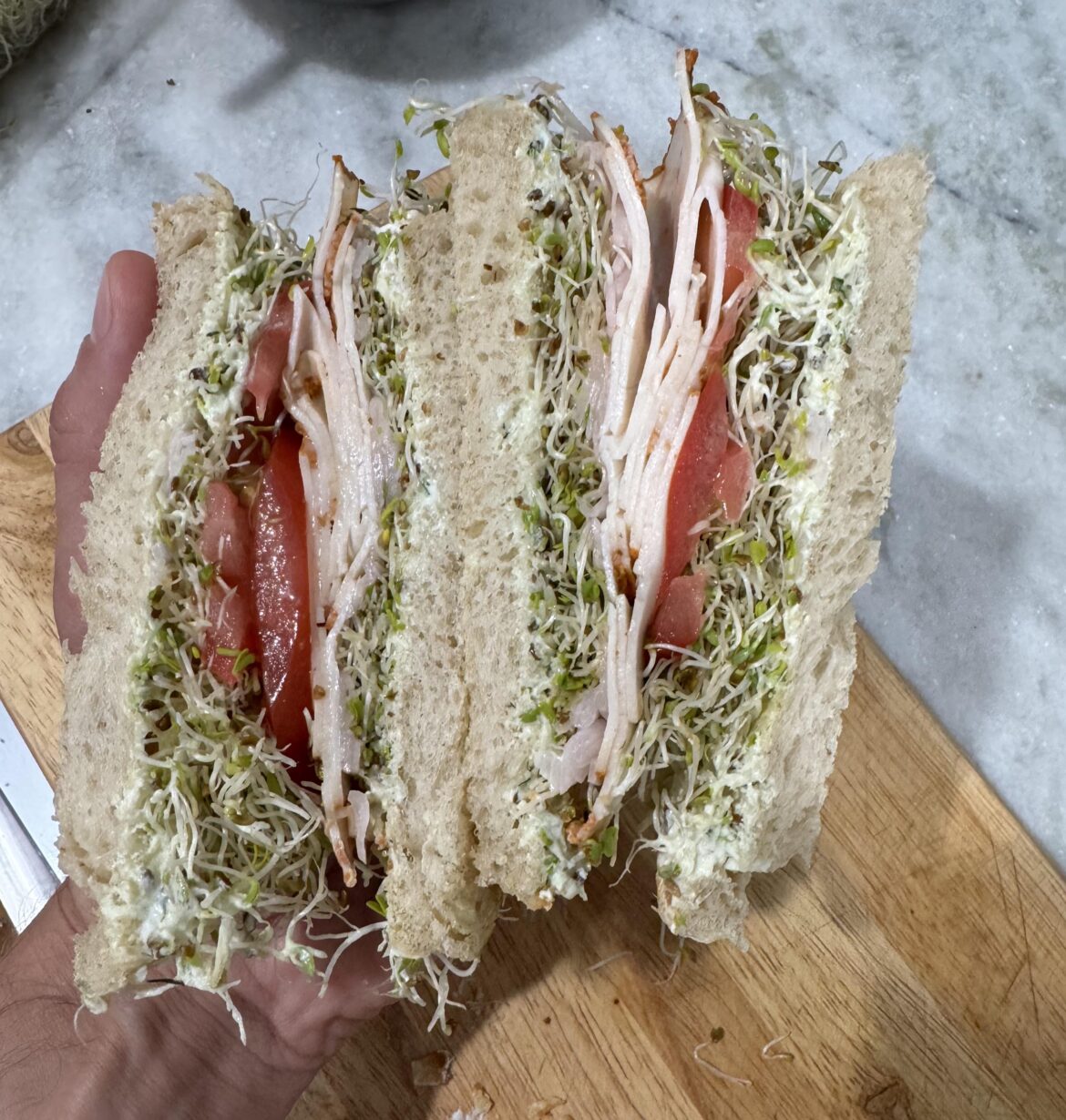 Turkey on sourdough with avocado ranch spread.