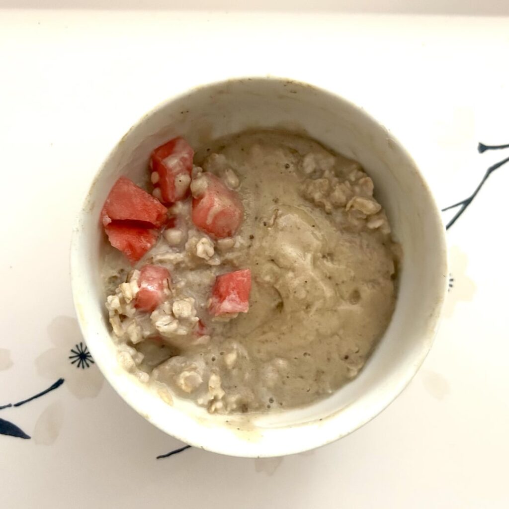 Post-run breakfast: protein oatmeal with banana nice cream and some watermelon. 345 calories