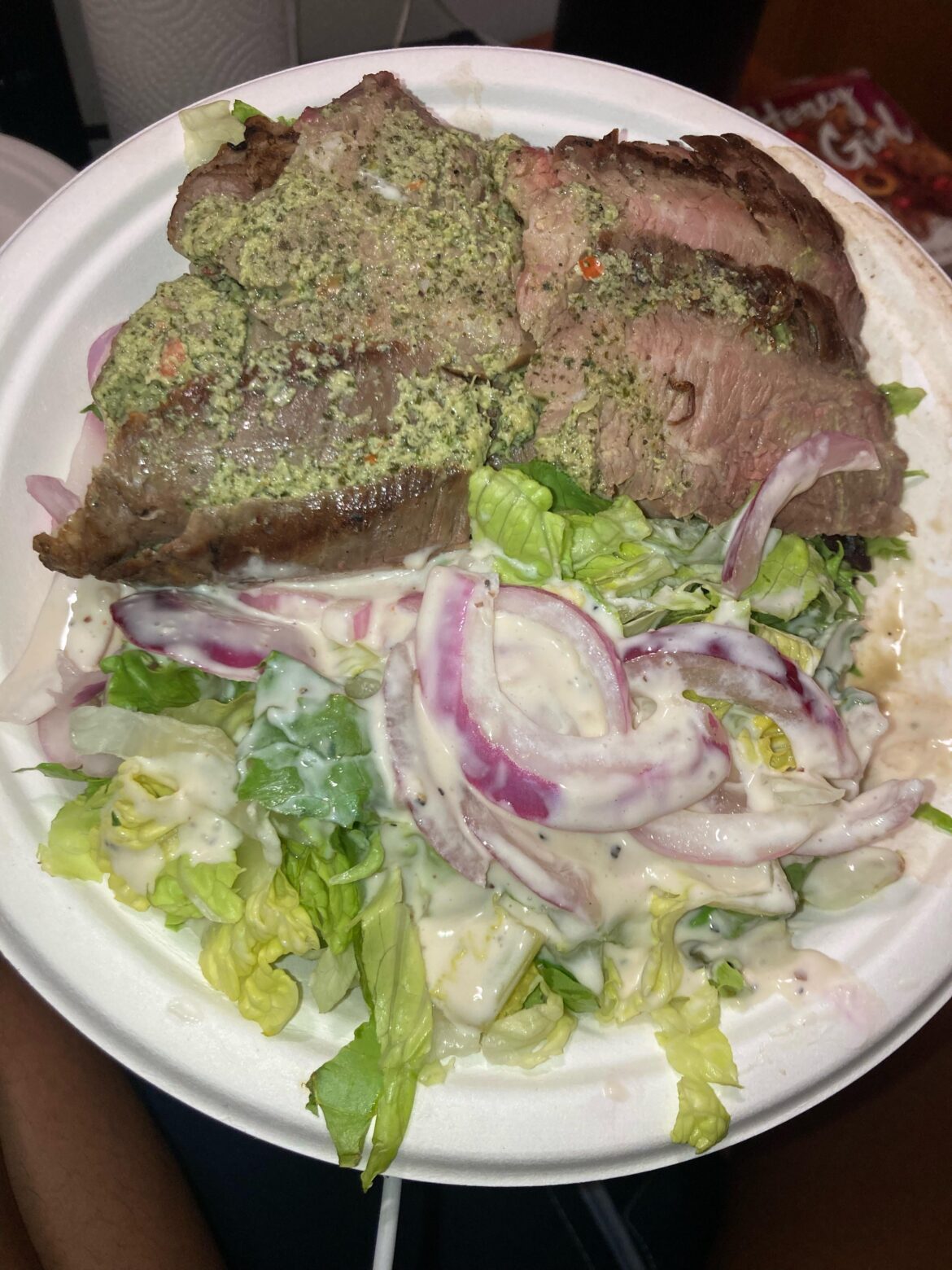 Skirt steak with SUPER garlicky Chimichurri and mixed green salad with onions and Cesar dressing