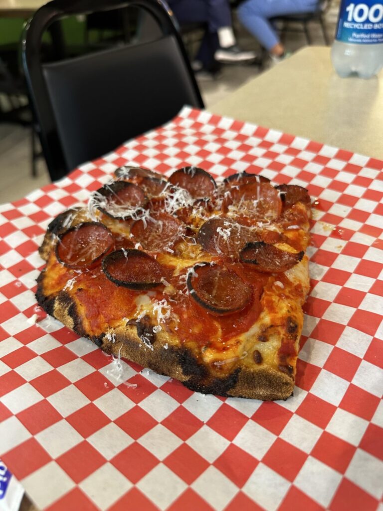 Nearly opened Pizza Di Roma. Serves different types of pizza, sandwiches, and pasta