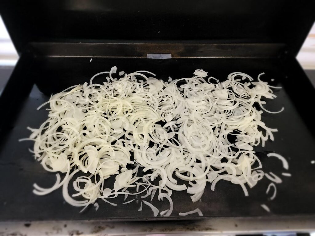 A lazy man’s BBQ pulled chicken with caramelized onions. A lazy man's BBQ pulled chicken with caramelized onions.