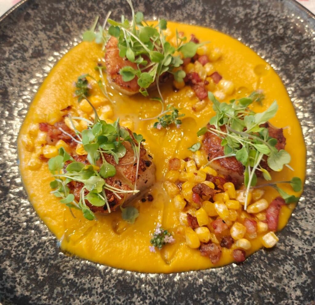 Seared Scallops with Corn and Pancetta topped with Arugula Microgreens over Butternut Squash Puree