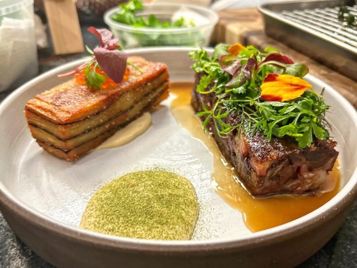 Braised and Pressed Oxtail, Nori Potato Pave, Smoked Onion Puree, Pho Spiced Jus, Wild Herb Salad
