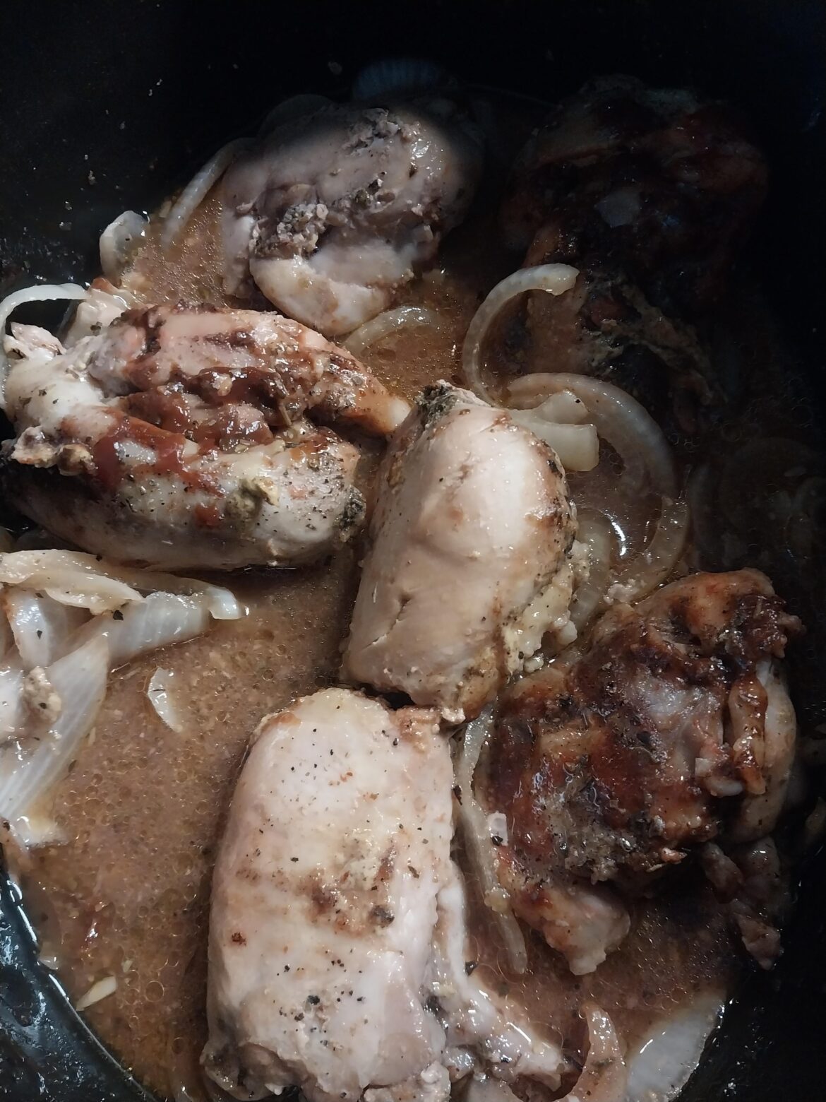 Chicken thighs spiced and sauced with some onion. Cooked on low for 4 hours.