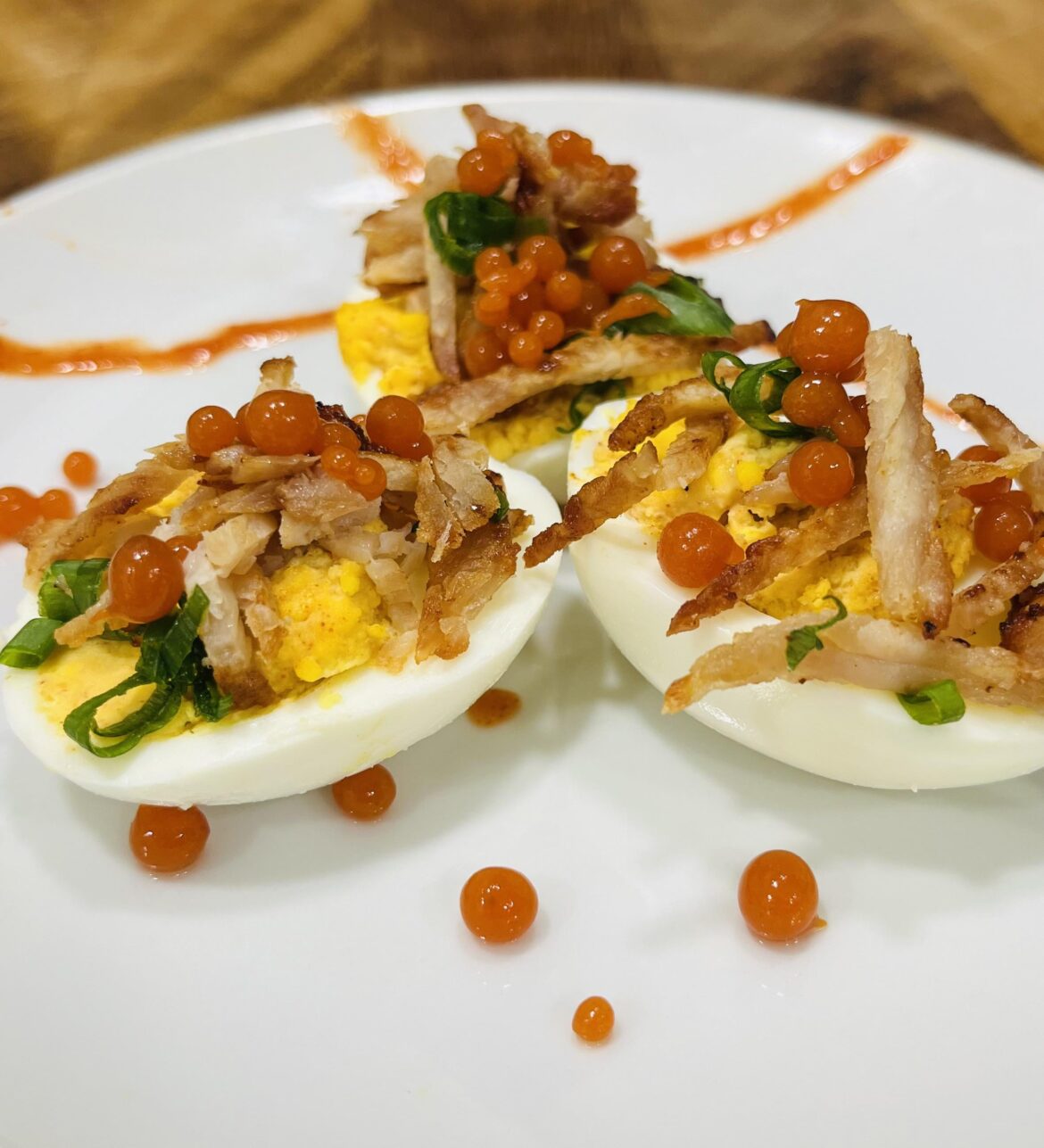 Pulled pork Deviled Eggs with Chipotle Caviar