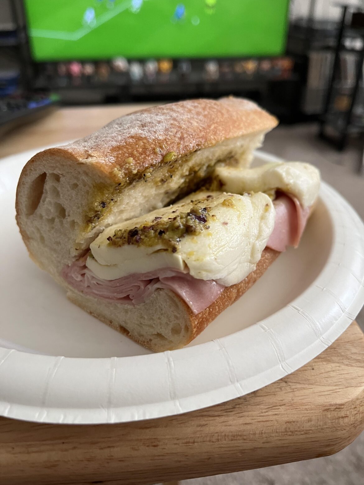 1/2 of a mortadella, mozzarella, and pesto sandwich - M’ama Napoli’s in Orlando, FL