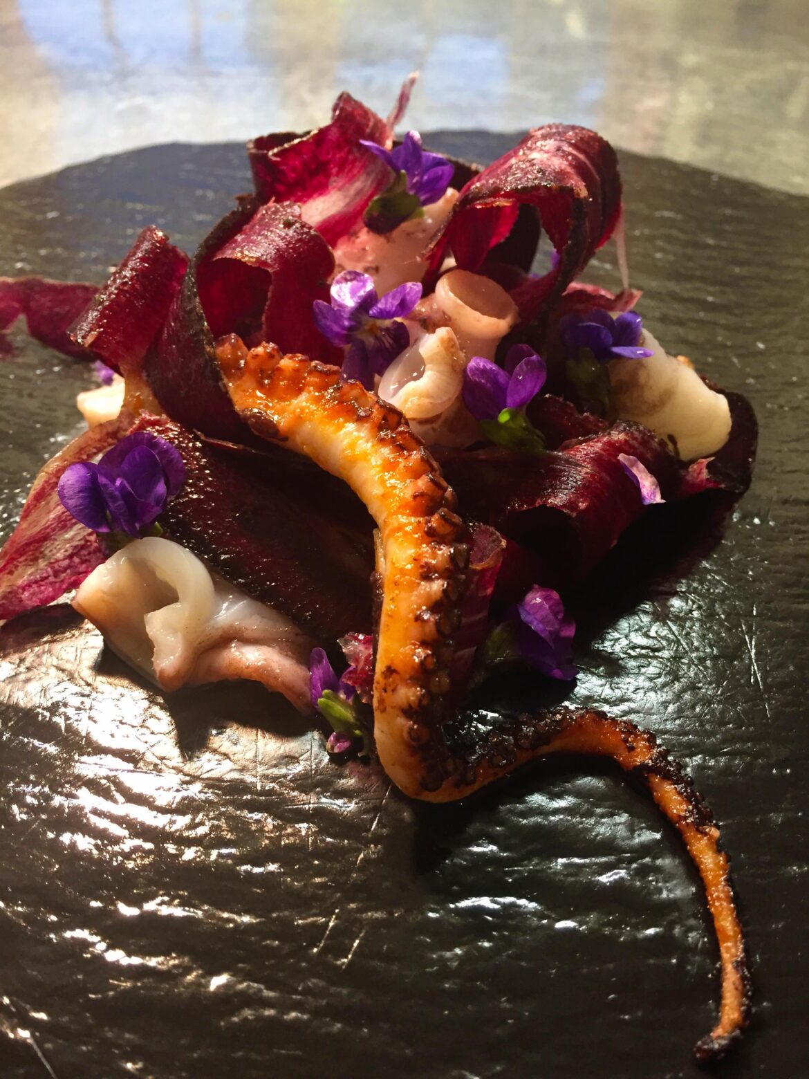 Grilled octopus with violets & pickled red carrot