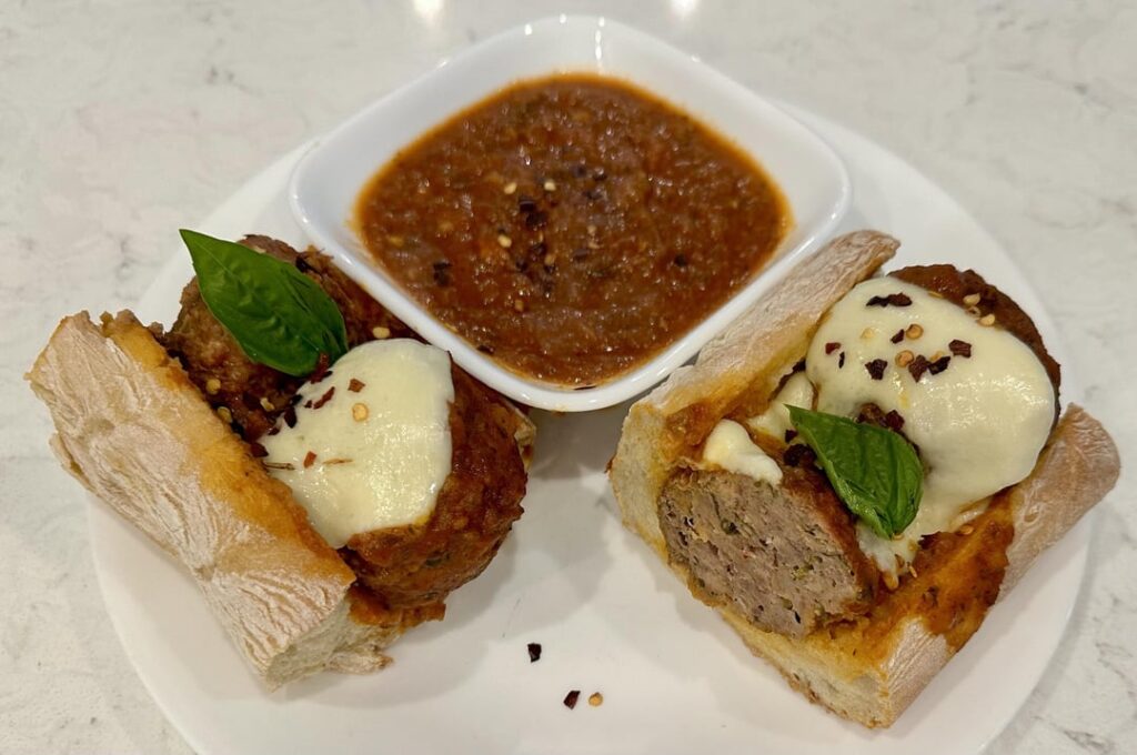 Beef and Pork Meatball Subs with Marinara on sourdough baguettes