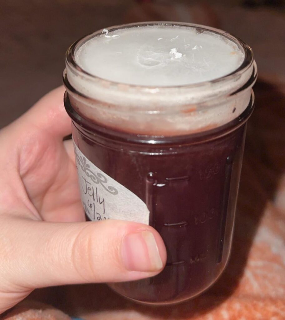 I just opened this jar of grape jelly my mom canned.