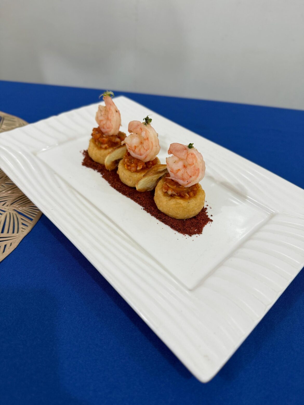 Cassava croquettes and chips, shrimp cocktail, beet pulverization and alfalfa sprouts.
