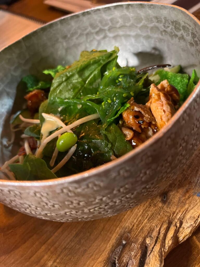 an amazing salad with salmon, drooling over it