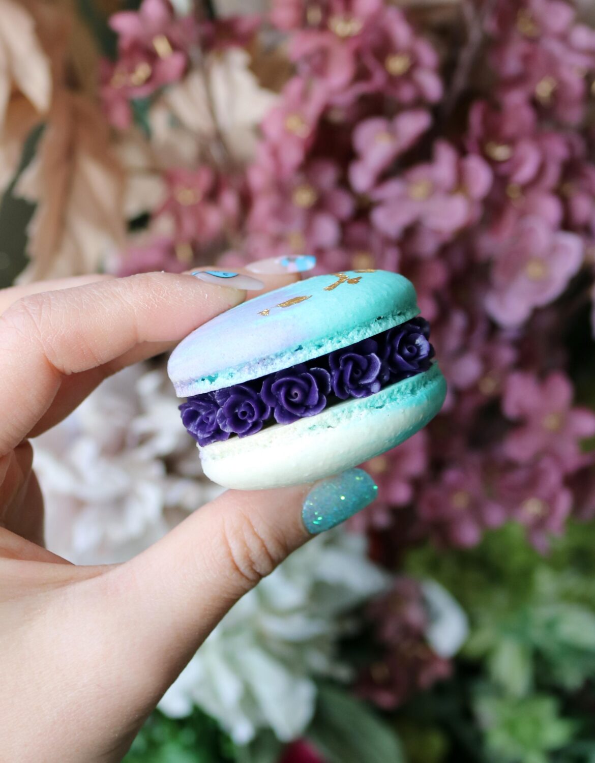 A month of failed macaron attempts wasted ingredients extreme frustration and slight weight increase from eating ugly shells... I now have 90% success rate! I can't do anything fancy with the shells yet but I can pipe pretty flowers in between.