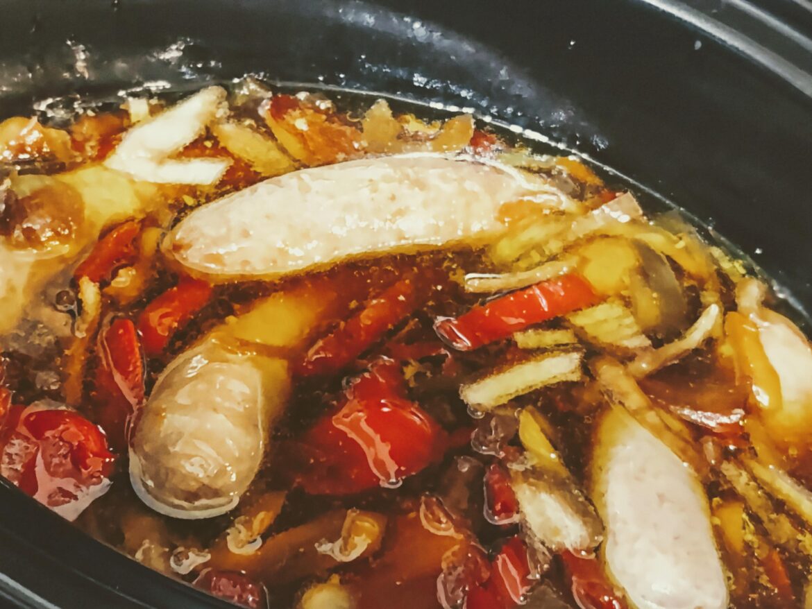Honey garlic sausages slow cooking in honey garlic sauce with peppers and onions to be served with garlic and rosemary mashed potatoes at 10 pm tonight (because I managed my time badly today) after 5 hours on high. I took this picture half way during the cooking process and also stirred it up a bit