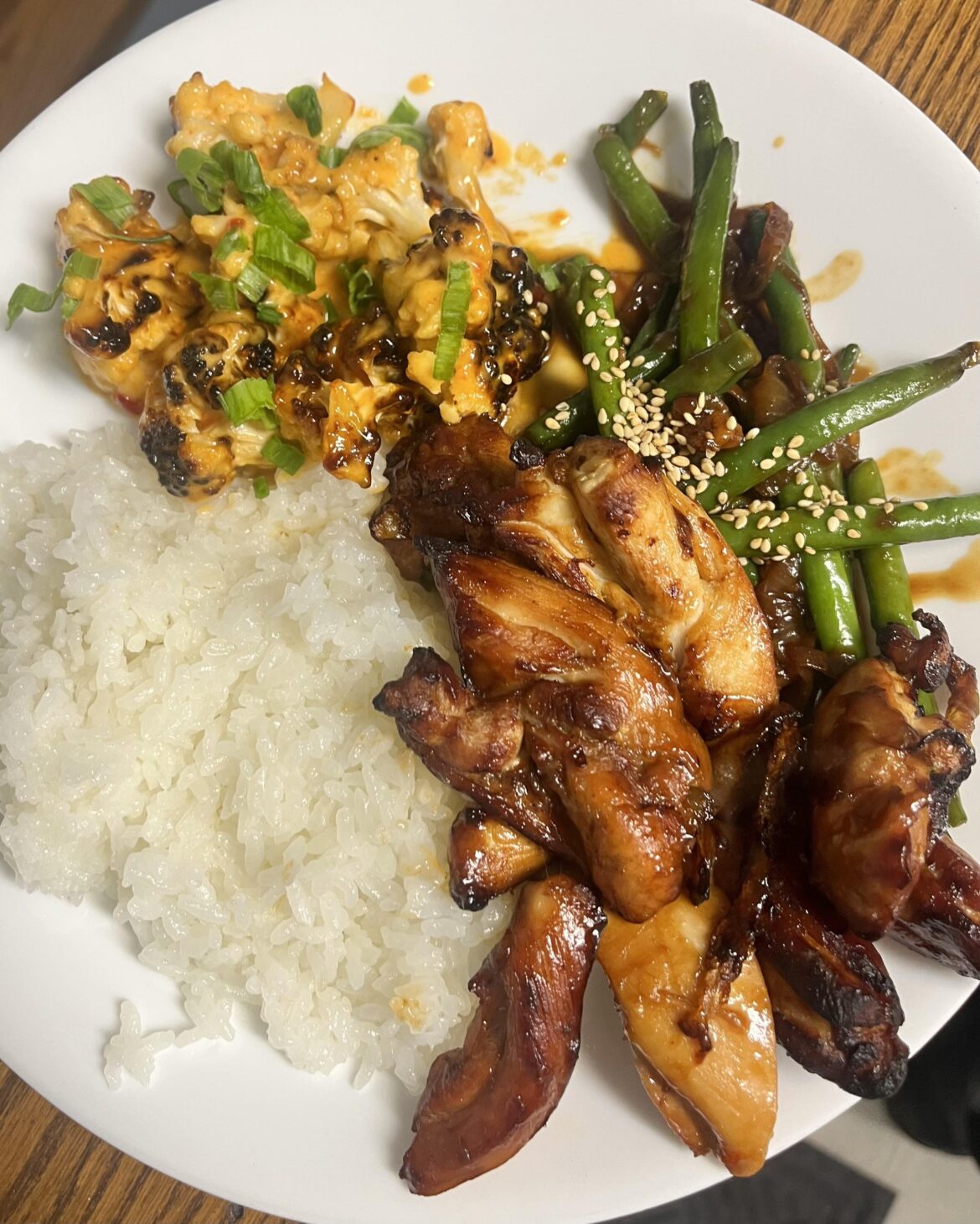 Firecracker cauliflower, sticky beans & chicken, and rice.
