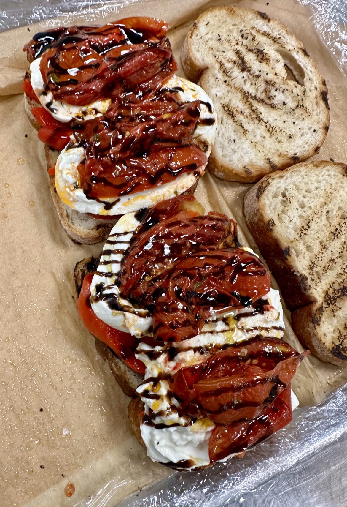 Roasted red peppers, burrata cheese, roasted tomatoes, balsamic glaze, olive oil and maldon salt.