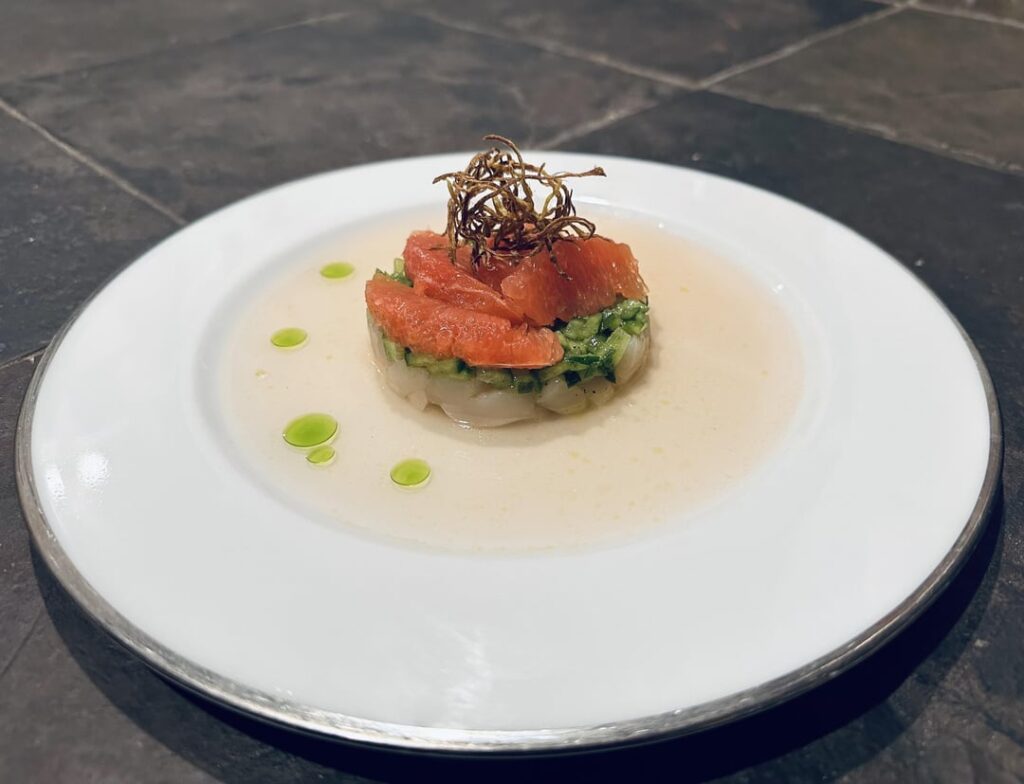 Hokkaido scallop crudo with grapefruit, burnt cucumber, crispy ginger, citrus shiro dashi and serrano oil