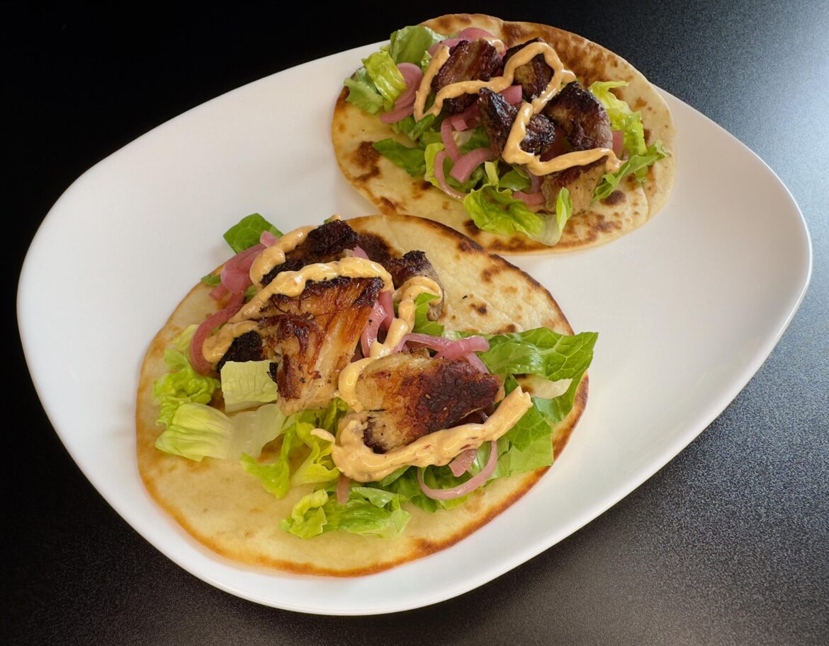 Kenji's carnitas with pickled red onions and chipotle mayonnaise.