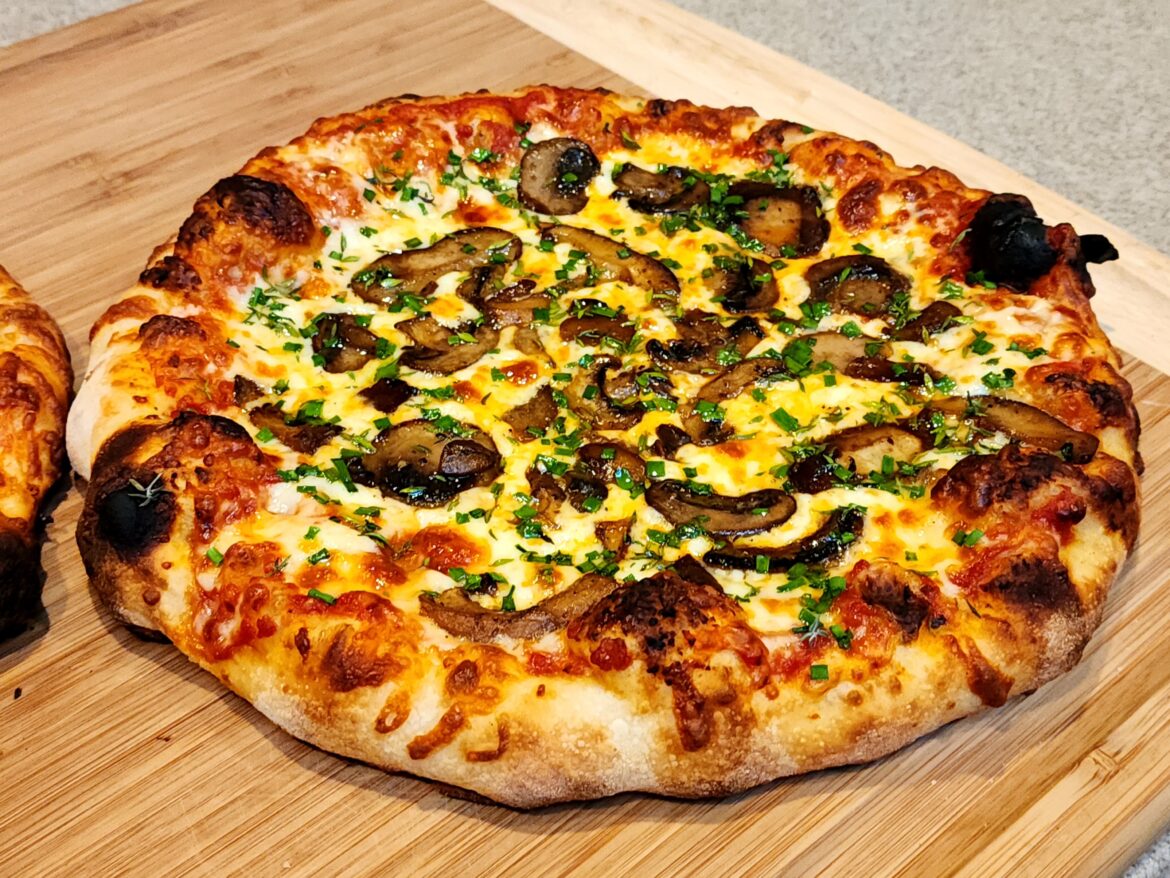 Cooked a couple pizzas today: One mushroom and herb, and one pepperoni and hatch chile