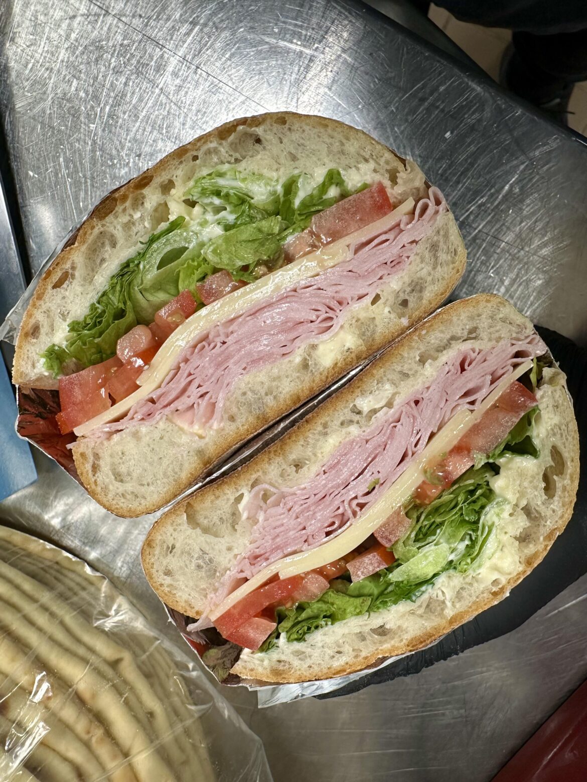 Ham and Swiss, mayo,lettuce, tomatoes, salt, pepper, oil and vinegar.