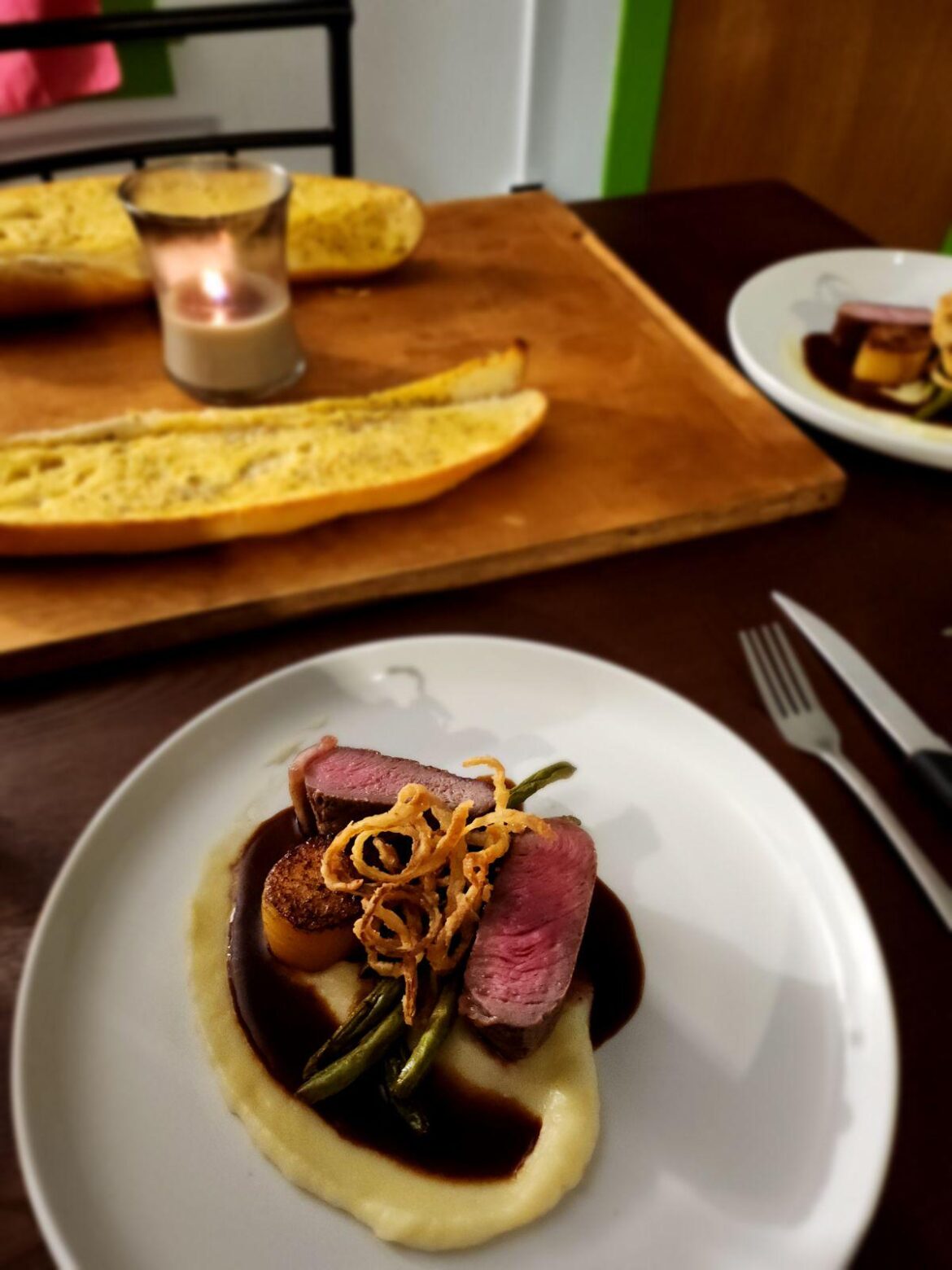 New York Strip|Yukon Potato Puree|Yukon Potato Fondant|Roasted Green Beans|Crispy Onion|Black Garlic Demi'