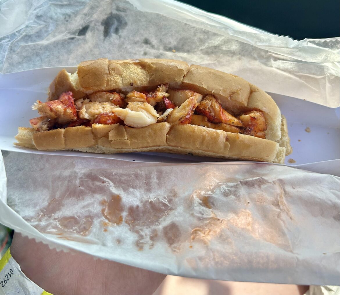 First lobster roll, at a taco truck festival First lobster roll, at a taco truck festival