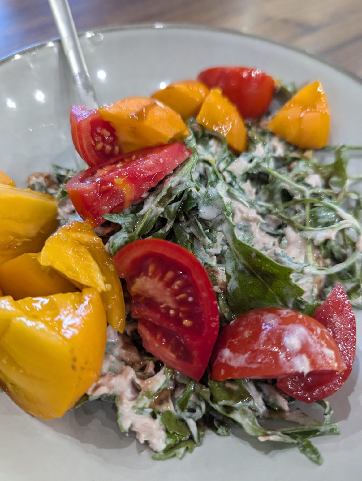 Tuna salad with yellow and red tomatos