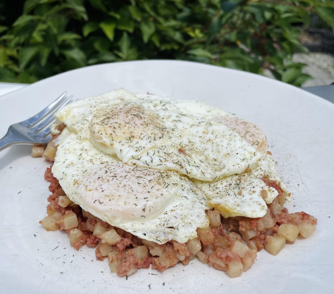 3 eggs over corned beef hash