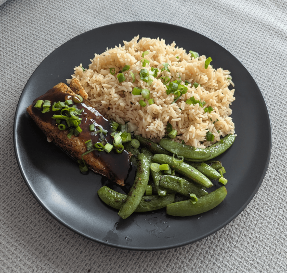 Brown Sugar-Glazed Salmon with Garlic Rice and Snap Peas