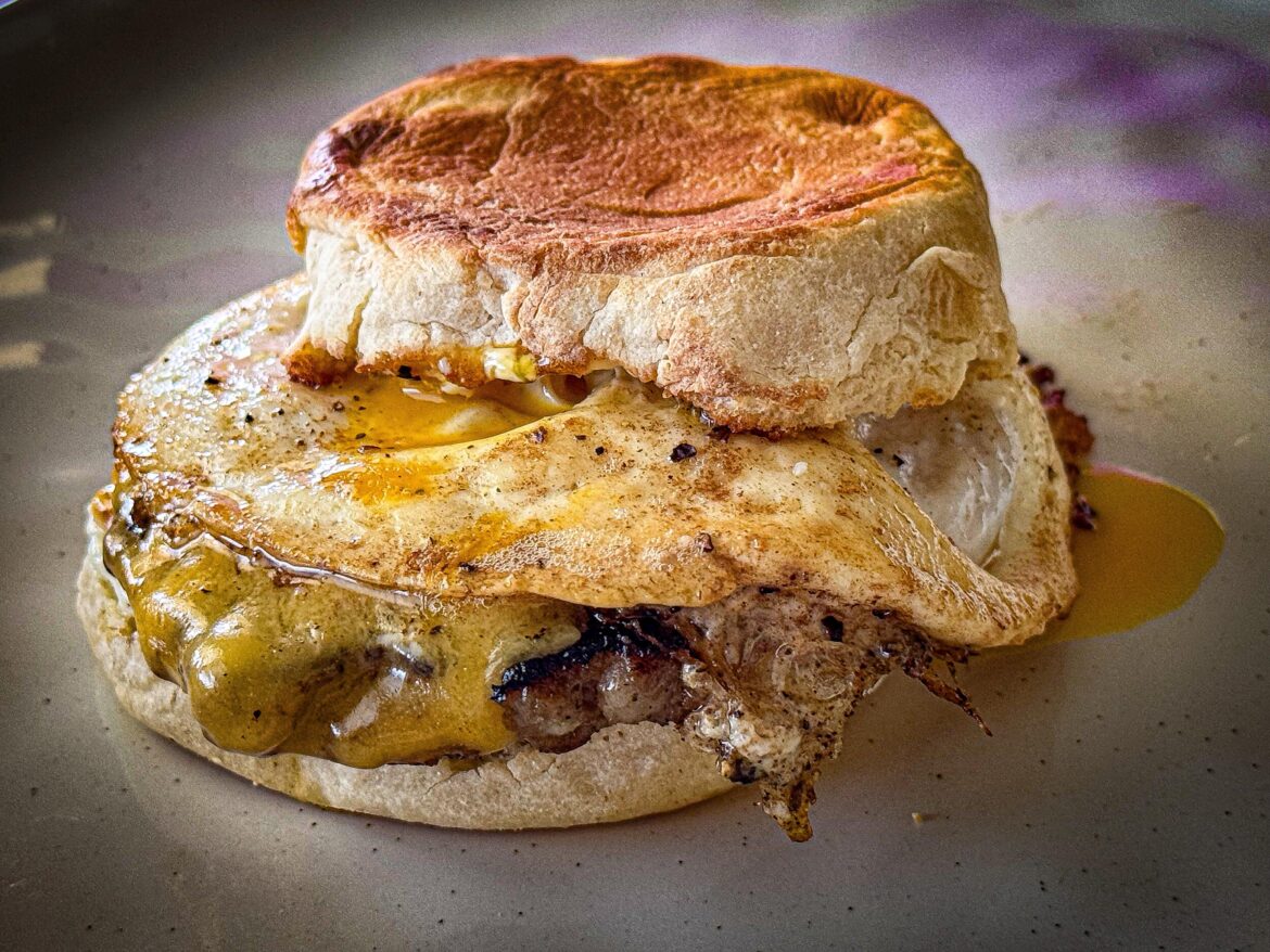 Country sausage, Tillamook sharp cheddar & fried egg on an English muffin