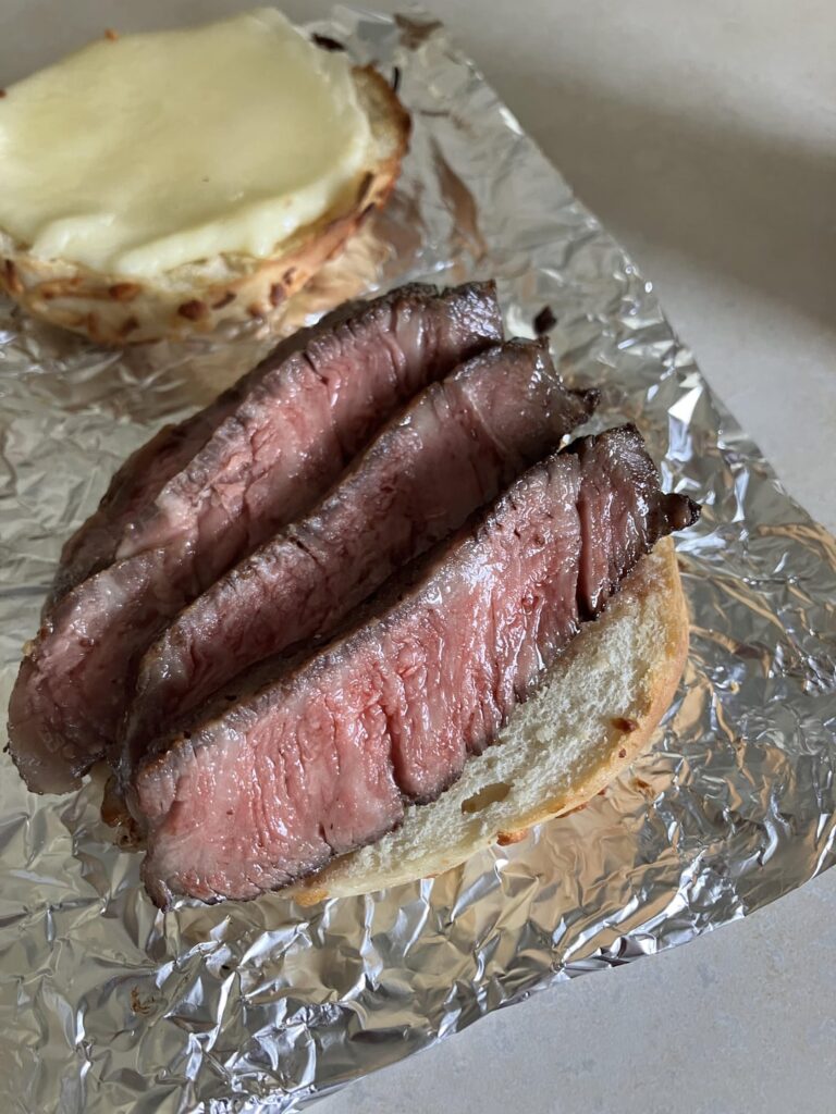 Leftover ribeye, hot cherry pepper mayo, provolone, homegrown tomato, Asiago bagel.  Last pic is from the steak last night