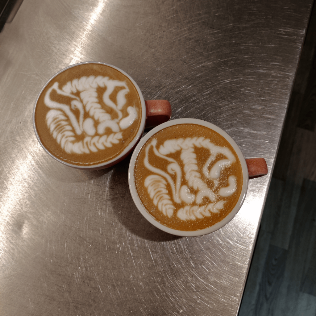 A pair of wild boars. Poured in Loveramics 300 ml cups using the WPM x KJ pitcher