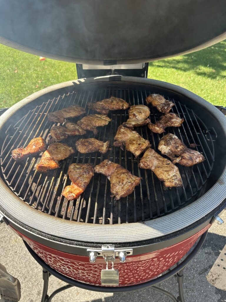 Reverse Seared Buffalo chicken thigh sandwiches served with goida, blue cheese, and pickles on a french roll