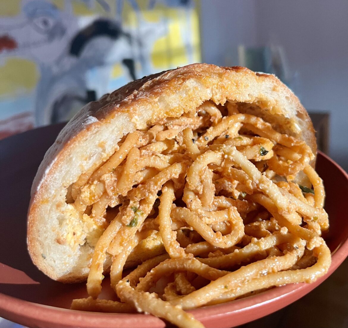 Impulse control lost today: homemade spaghetti stuffed inside half a hollowed-out fresh rosemary and potato loaf. Phenomenal flavor, but I’m going to promptly fall asleep now.