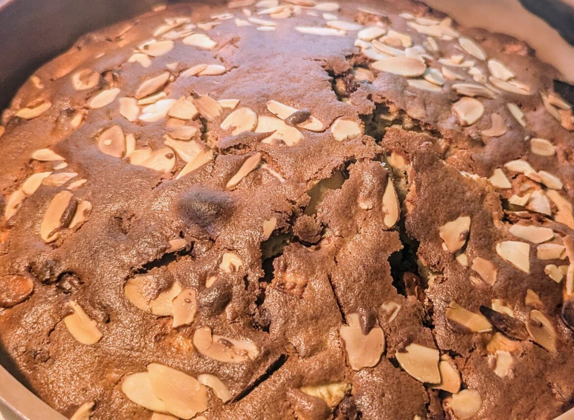 Apple and mascarpone cake topped with almond flakes