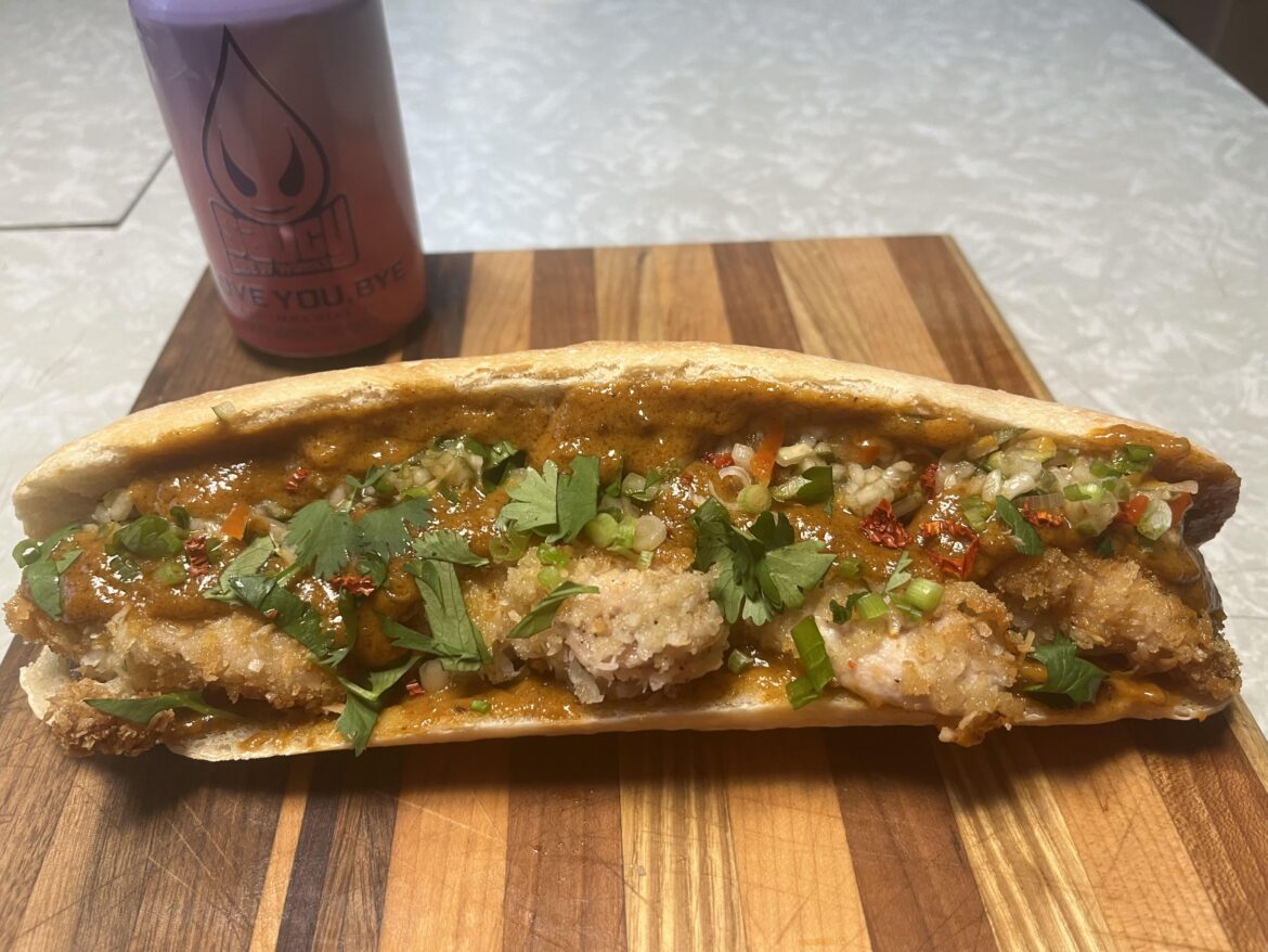 Coconut chicken with minced cucumber pickle and satay sauce sandwich