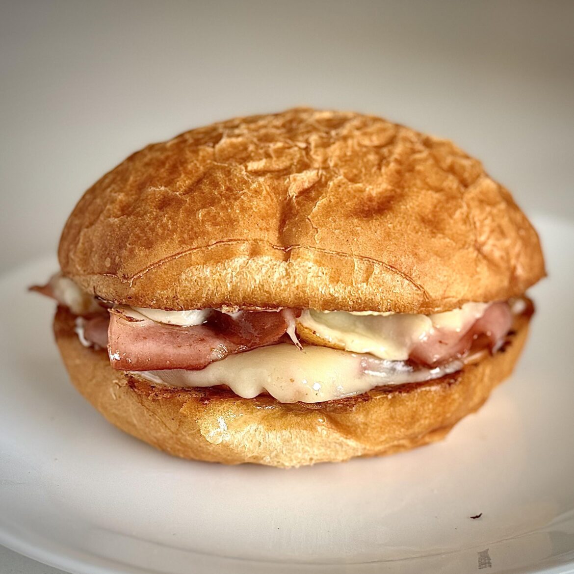Fried mortadella and provolone on a Kaiser roll. Anthony Bourdain’s favorite sandwich.