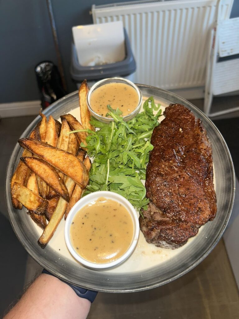 Steak, homemade chips & peppercorn sauce and some rocket for health reasons
