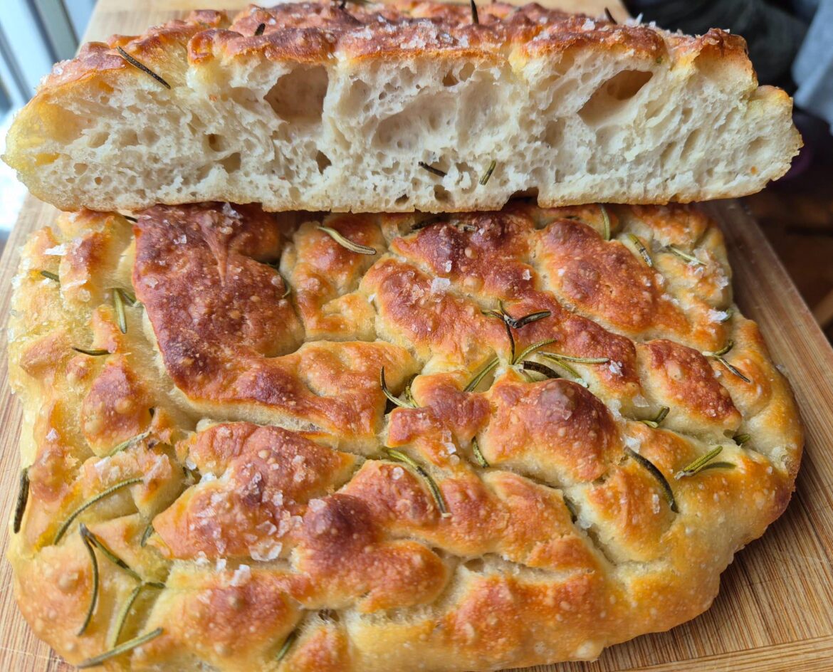 Made focaccia with rosemary from my mom's garden, it was too hot when I cut into it but I couldn't wait it was delicious