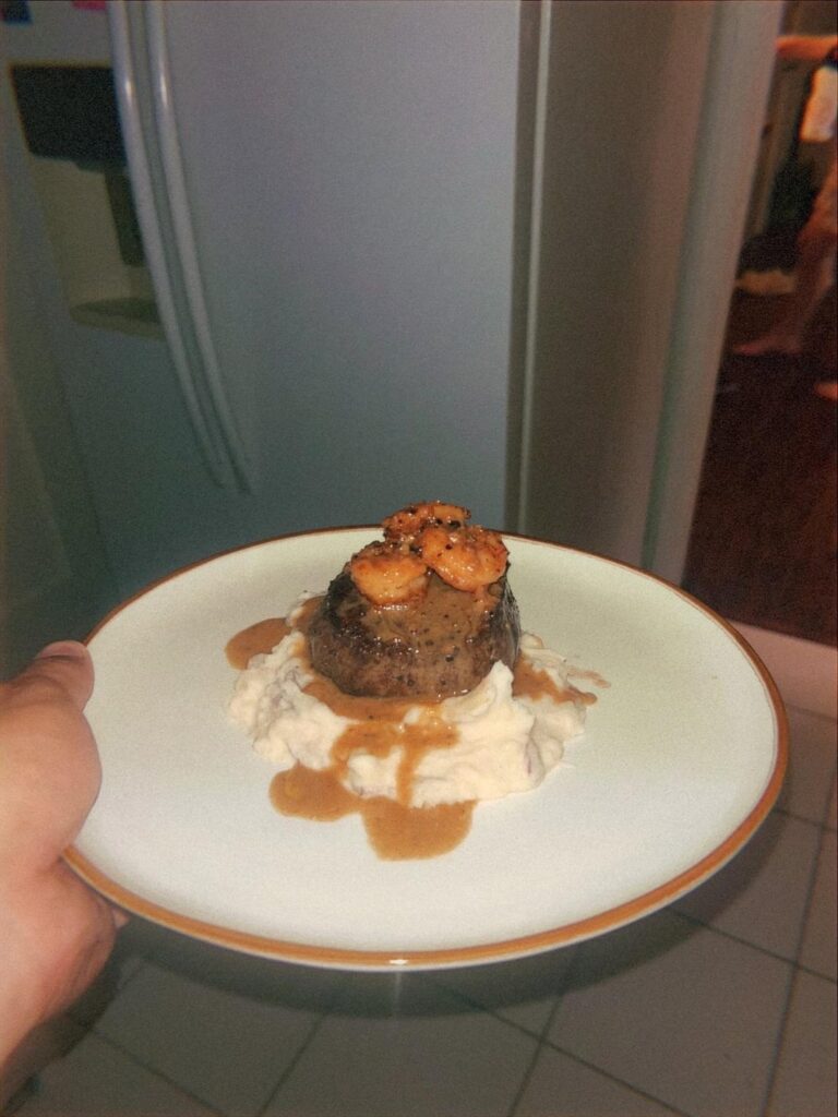 Surf n Turf with a white wine peppercorn sauce and mashed potatoes