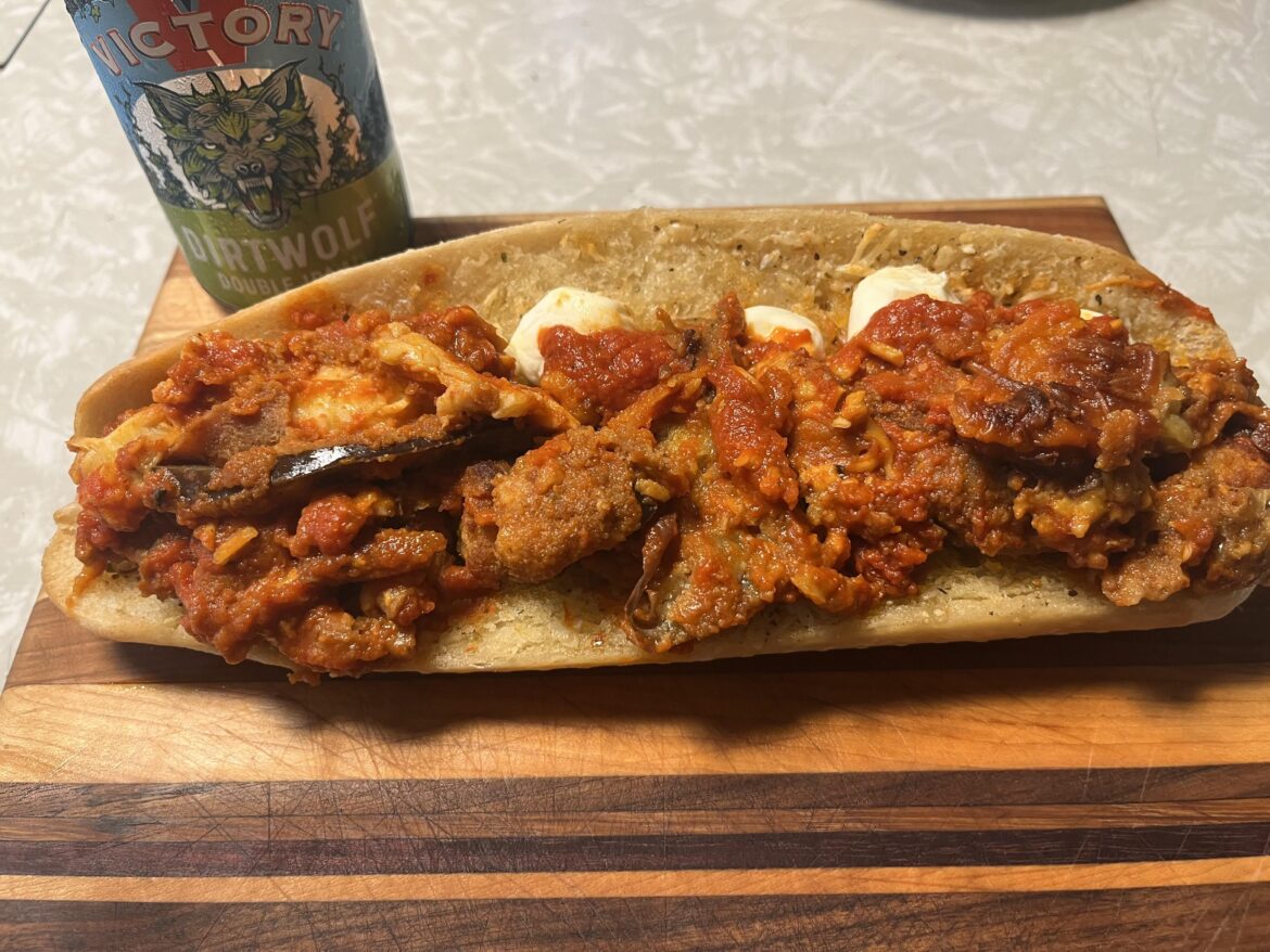 Breaded mushroom, chicken and eggplant Parmesan on a garlic bread broiled baguette